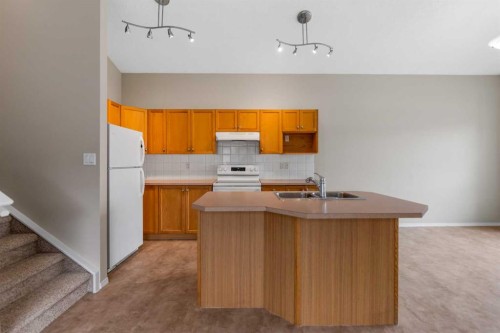 86 Saddlemont Close Ne, Calgary, AB - Indoor Photo Showing Kitchen With Double Sink