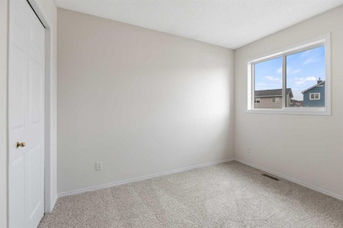 86 Saddlemont Close Ne, Calgary, AB - Indoor Photo Showing Other Room