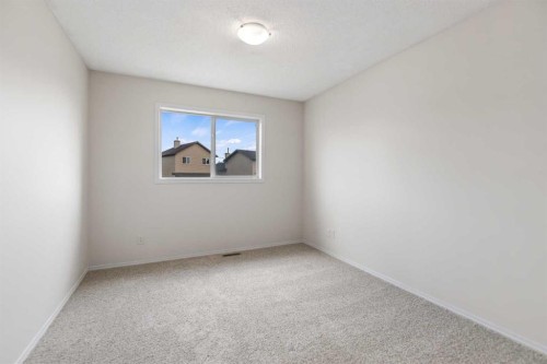 86 Saddlemont Close Ne, Calgary, AB - Indoor Photo Showing Other Room