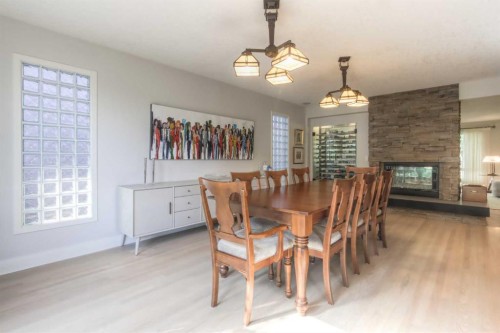 1702 24 Street Sw, Calgary, AB - Indoor Photo Showing Dining Room With Fireplace