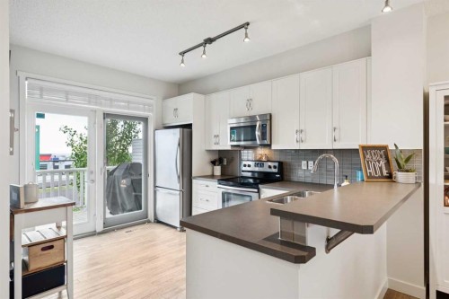 206 Nolanfield Villas Nw, Calgary, AB - Indoor Photo Showing Kitchen With Stainless Steel Kitchen With Double Sink