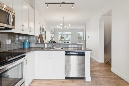 206 Nolanfield Villas Nw, Calgary, AB - Indoor Photo Showing Kitchen With Stainless Steel Kitchen With Double Sink