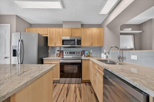 3146 New Brighton Gardens Se, Calgary, AB - Indoor Photo Showing Kitchen With Stainless Steel Kitchen With Double Sink