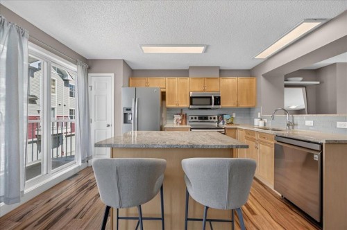 3146 New Brighton Gardens Se, Calgary, AB - Indoor Photo Showing Kitchen With Stainless Steel Kitchen