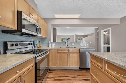 3146 New Brighton Gardens Se, Calgary, AB - Indoor Photo Showing Kitchen With Stainless Steel Kitchen