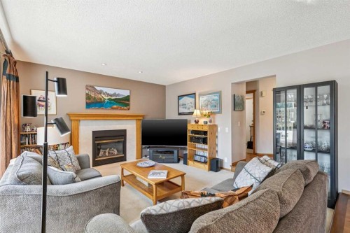 124 Schubert Hill Nw, Calgary, AB - Indoor Photo Showing Living Room With Fireplace