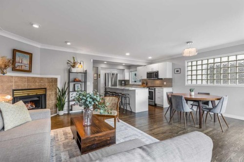 2031 2 Avenue Nw, Calgary, AB - Indoor Photo Showing Living Room With Fireplace