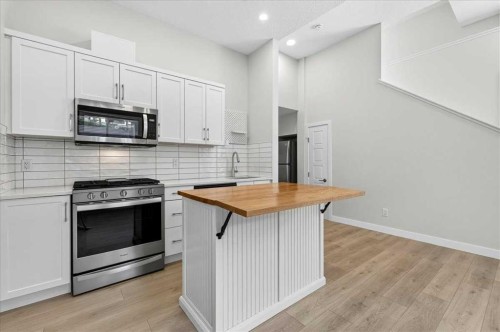 199 Magnolia Way Se, Calgary, AB - Indoor Photo Showing Kitchen With Upgraded Kitchen