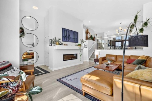 199 Magnolia Way Se, Calgary, AB - Indoor Photo Showing Living Room With Fireplace