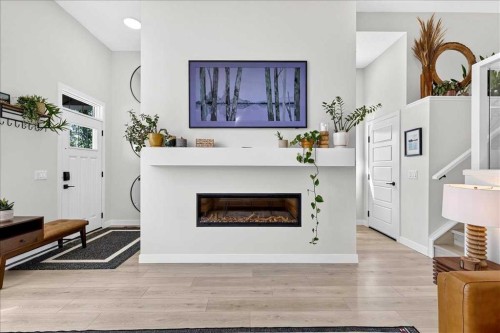 199 Magnolia Way Se, Calgary, AB - Indoor Photo Showing Living Room With Fireplace