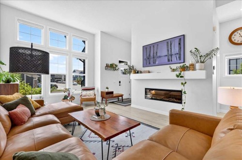 199 Magnolia Way Se, Calgary, AB - Indoor Photo Showing Living Room With Fireplace