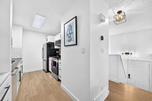 D-109 Stanley Avenue, Okotoks, AB - Indoor Photo Showing Kitchen