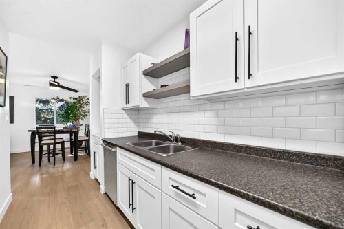 D-109 Stanley Avenue, Okotoks, AB - Indoor Photo Showing Kitchen With Double Sink