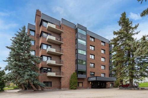 4N-222 Eagle Ridge Drive Sw, Calgary, AB - Outdoor With Balcony With Facade