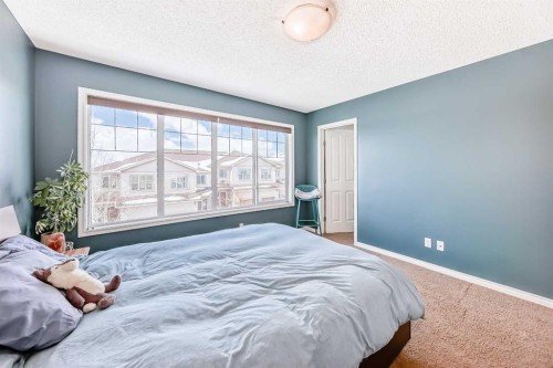 296 Sunset Point, Cochrane, AB - Indoor Photo Showing Bedroom