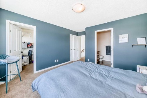 296 Sunset Point, Cochrane, AB - Indoor Photo Showing Bedroom