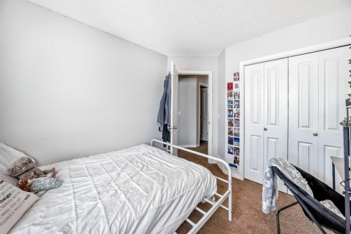 296 Sunset Point, Cochrane, AB - Indoor Photo Showing Bedroom