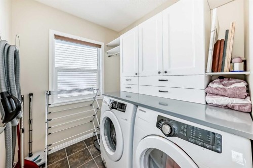 296 Sunset Point, Cochrane, AB - Indoor Photo Showing Laundry Room