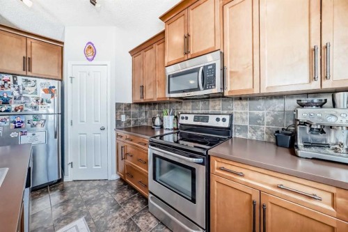 296 Sunset Point, Cochrane, AB - Indoor Photo Showing Kitchen With Stainless Steel Kitchen