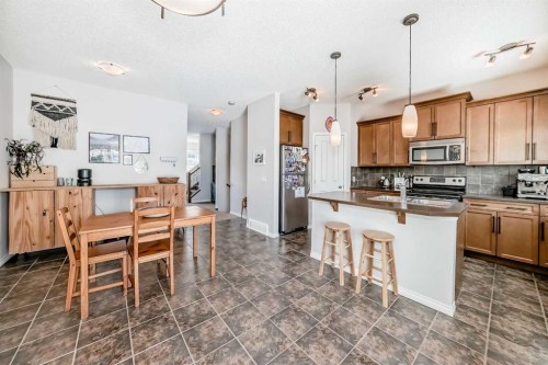 296 Sunset Point, Cochrane, AB - Indoor Photo Showing Kitchen With Stainless Steel Kitchen