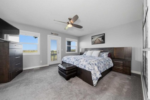 395 Boulder Creek Bay Se, Langdon, AB - Indoor Photo Showing Bedroom
