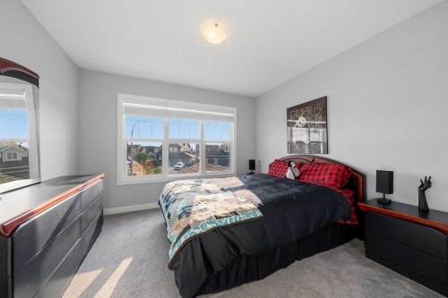 395 Boulder Creek Bay Se, Langdon, AB - Indoor Photo Showing Bedroom