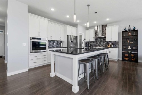 395 Boulder Creek Bay Se, Langdon, AB - Indoor Photo Showing Kitchen With Upgraded Kitchen