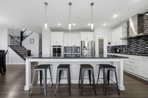 395 Boulder Creek Bay Se, Langdon, AB - Indoor Photo Showing Kitchen With Upgraded Kitchen