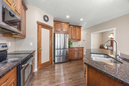 162 Sherwood Hill Nw, Calgary, AB - Indoor Photo Showing Kitchen With Stainless Steel Kitchen With Double Sink
