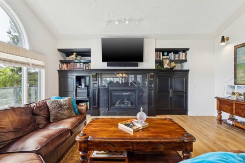 84 Edenstone Way Nw, Calgary, AB - Indoor Photo Showing Living Room With Fireplace