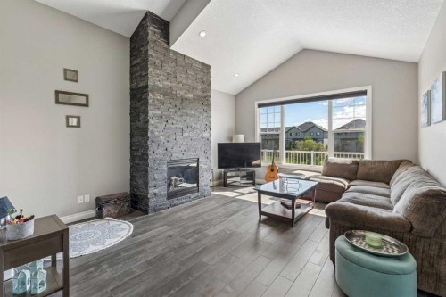 2257 Bayside Circle Sw, Airdrie, AB - Indoor Photo Showing Living Room With Fireplace