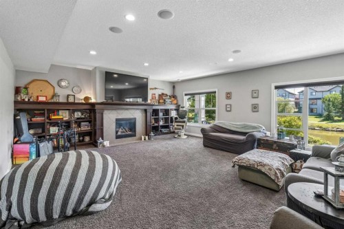 2257 Bayside Circle Sw, Airdrie, AB - Indoor With Fireplace