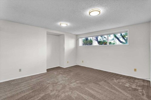 228 Nottingham Road Nw, Calgary, AB - Indoor Photo Showing Other Room