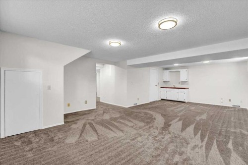 228 Nottingham Road Nw, Calgary, AB - Indoor Photo Showing Other Room