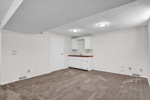 228 Nottingham Road Nw, Calgary, AB - Indoor Photo Showing Other Room