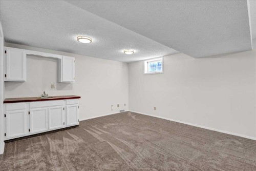 228 Nottingham Road Nw, Calgary, AB - Indoor Photo Showing Other Room