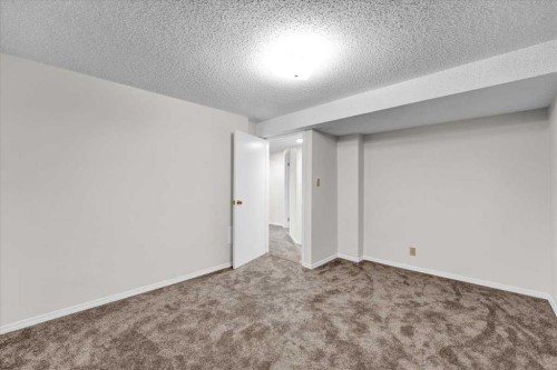 228 Nottingham Road Nw, Calgary, AB - Indoor Photo Showing Other Room