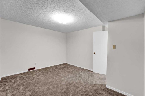 228 Nottingham Road Nw, Calgary, AB - Indoor Photo Showing Other Room