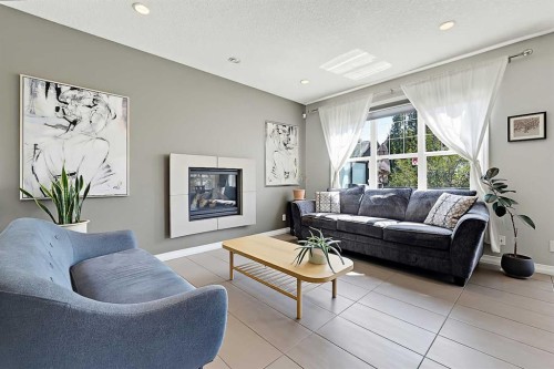 71 Chaparral Valley Way Se, Calgary, AB - Indoor Photo Showing Living Room With Fireplace