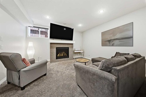 71 Chaparral Valley Way Se, Calgary, AB - Indoor Photo Showing Living Room With Fireplace
