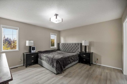 52 Shawnee Way Sw, Calgary, AB - Indoor Photo Showing Bedroom