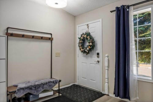 52 Shawnee Way Sw, Calgary, AB - Indoor Photo Showing Other Room