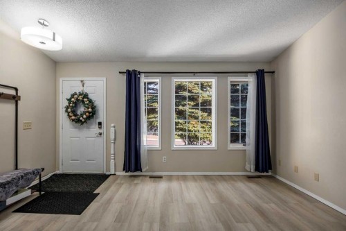 52 Shawnee Way Sw, Calgary, AB - Indoor Photo Showing Other Room