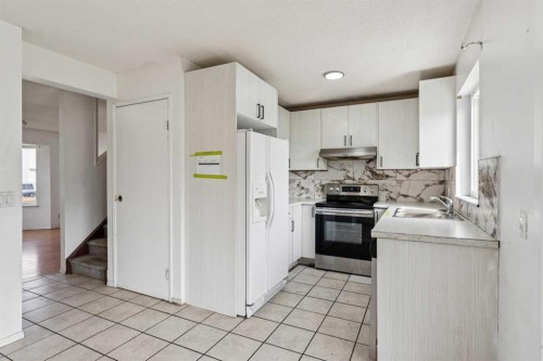 104 Falmere Way Ne, Calgary, AB - Indoor Photo Showing Kitchen With Double Sink