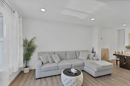 25 Savanna Manor Ne, Calgary, AB - Indoor Photo Showing Living Room
