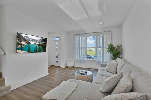 25 Savanna Manor Ne, Calgary, AB - Indoor Photo Showing Living Room