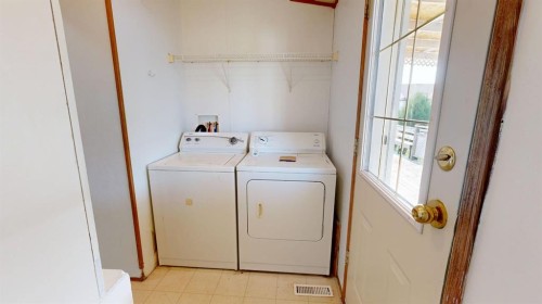 1905 29 Avenue, Nanton, AB - Indoor Photo Showing Laundry Room