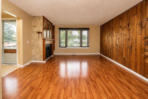7 Dovercliffe Way Se, Calgary, AB - Indoor Photo Showing Other Room With Fireplace