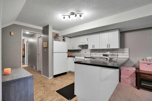 3429 Cedarille Drive Sw, Calgary, AB - Indoor Photo Showing Kitchen With Double Sink