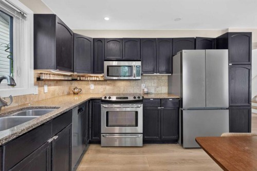 113 Riverview Court West, Calgary, AB - Indoor Photo Showing Kitchen With Stainless Steel Kitchen With Double Sink